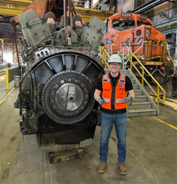 Quentin Schraeder in the BNSF shop with a diesel engine
